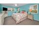 Bright bedroom with large windows, ceiling fan, TV, and neutral carpet at 6190 80Th N St # 411, St Petersburg, FL 33709