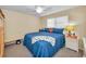 Inviting bedroom featuring a full bed, light walls, and ample natural light at 6190 80Th N St # 411, St Petersburg, FL 33709