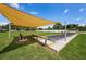 Outdoor bocce ball court with sunshade at 6190 80Th N St # 411, St Petersburg, FL 33709