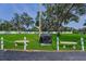 Outdoor community area featuring picnic tables and a charcoal grill with meticulous landscaping at 6190 80Th N St # 411, St Petersburg, FL 33709