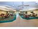 Community room with tables and chairs, television, and neutral color palette at 6190 80Th N St # 411, St Petersburg, FL 33709