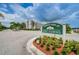 Community sign for Terrace Park of Five Towns featuring lush landscaping and mature trees at 6190 80Th N St # 411, St Petersburg, FL 33709