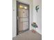 Front door of home, next to decorative parrot and frog welcome sign at 6190 80Th N St # 411, St Petersburg, FL 33709