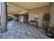 Building entrance featuring tile floors, benches, potted plants, and nautical decor at 6190 80Th N St # 411, St Petersburg, FL 33709