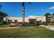 A view of the community's clubhouse building on a sunny day at 6190 80Th N St # 411, St Petersburg, FL 33709