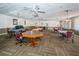 Game room with multiple game tables, carpet, and ceiling fans at 6190 80Th N St # 411, St Petersburg, FL 33709
