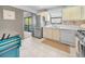 This well-lit kitchen boasts stainless steel appliances and tiled backsplash at 6190 80Th N St # 411, St Petersburg, FL 33709