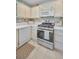 The kitchen is well-equipped with stainless steel appliances, light cabinetry, and backsplash at 6190 80Th N St # 411, St Petersburg, FL 33709