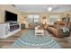 Bright and open living room with stylish decor, comfortable seating, and a cozy ambiance at 6190 80Th N St # 411, St Petersburg, FL 33709