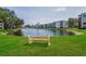 Enjoy the tranquil setting with pond view and park benches in this meticulously maintained community at 6190 80Th N St # 411, St Petersburg, FL 33709
