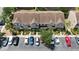 Aerial view of townhomes with parking spaces and a manicured landscape at 6231 Bayside Key Dr, Tampa, FL 33615
