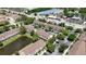 Aerial view of the condo complex, featuring a pond and beautiful landscaping at 6231 Bayside Key Dr, Tampa, FL 33615
