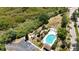 Overhead view of a community pool and surrounding green spaces and parking at 6231 Bayside Key Dr, Tampa, FL 33615