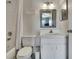 Bright bathroom with a shower-tub combination, modern vanity, and neutral decor at 6231 Bayside Key Dr, Tampa, FL 33615