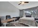 Comfortable bedroom with a ceiling fan, large window, and space for a desk at 6231 Bayside Key Dr, Tampa, FL 33615