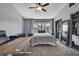 Comfortable bedroom with a ceiling fan, large window, closet and space for a desk at 6231 Bayside Key Dr, Tampa, FL 33615