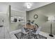 Dining area features a modern table with four chairs with an open view to the kitchen at 6231 Bayside Key Dr, Tampa, FL 33615