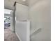 Upstairs hallway with access to bedrooms, featuring neutral carpet and white trim at 6231 Bayside Key Dr, Tampa, FL 33615