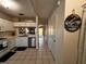 Inviting hallway with a 'Welcome' sign leading to the kitchen and living areas at 6231 Bayside Key Dr, Tampa, FL 33615