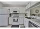 Functional kitchen features white cabinets, modern appliances, and an efficient layout at 6231 Bayside Key Dr, Tampa, FL 33615
