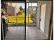 This screened-in patio has a grill and overlooks the lawn at 6231 Bayside Key Dr, Tampa, FL 33615