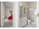 Bathroom featuring white vanity, framed mirror, and a glass shower with tiled accents at 7206 River Country Dr, Weeki Wachee, FL 34607