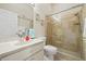 Bathroom with white vanity, framed mirror, glass shower, and neutral color walls at 7206 River Country Dr, Weeki Wachee, FL 34607
