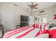 Bright bedroom featuring two beds and access to a pool area at 7206 River Country Dr, Weeki Wachee, FL 34607