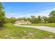 Charming home with a long driveway, nestled amidst a lush, green landscape at 7206 River Country Dr, Weeki Wachee, FL 34607