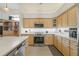 Updated kitchen showcases stainless appliances, bright cabinets and countertops at 7206 River Country Dr, Weeki Wachee, FL 34607