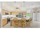 Eat-in kitchen includes an island with seating and stainless steel appliances at 7206 River Country Dr, Weeki Wachee, FL 34607
