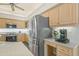 Bright kitchen featuring stainless steel refrigerator and modern appliances at 7206 River Country Dr, Weeki Wachee, FL 34607