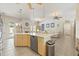 Open kitchen island featuring stainless steel dishwasher and eat-in counter at 7206 River Country Dr, Weeki Wachee, FL 34607