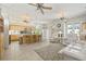 Bright open concept featuring the living room and kitchen with tile flooring at 7206 River Country Dr, Weeki Wachee, FL 34607