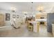Spacious living room and kitchen feature tile floors and ceiling fans at 7206 River Country Dr, Weeki Wachee, FL 34607