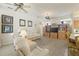 Cozy living room with tile floors, ceiling fans, and open floor plan at 7206 River Country Dr, Weeki Wachee, FL 34607