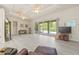 Spacious living room with wood floors, glass sliders, and comfortable seating at 7206 River Country Dr, Weeki Wachee, FL 34607