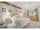 Bright main bedroom with king bed, carpet and dresser, with decorated shelf overhead and natural lighting at 7206 River Country Dr, Weeki Wachee, FL 34607