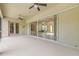 Covered patio with ceiling fans and sliding glass doors to the main living area at 7206 River Country Dr, Weeki Wachee, FL 34607