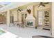 Covered patio space includes an outdoor fireplace and view of the pool at 7206 River Country Dr, Weeki Wachee, FL 34607