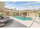 Covered pool area features a spa, fireplace and outdoor living spaces for relaxation at 7206 River Country Dr, Weeki Wachee, FL 34607