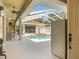 View of the pool area from inside the home, featuring a refrigerator and sitting area at 7206 River Country Dr, Weeki Wachee, FL 34607
