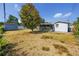 Large backyard with shade tree, shed, and screened patio; an outdoor oasis at 7777 117Th St, Seminole, FL 33772