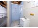 Garage shower features a single sink vanity, exposed ceiling, and functional design at 7777 117Th St, Seminole, FL 33772