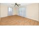 Bedroom featuring hard wood floors, a ceiling fan, and natural lighting at 7777 117Th St, Seminole, FL 33772