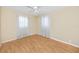 Bedroom featuring hardwood floors, a ceiling fan, and natural lighting at 7777 117Th St, Seminole, FL 33772