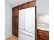 Modern kitchen with pantry and a large refrigerator at 7777 117Th St, Seminole, FL 33772
