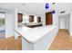 Kitchen featuring a stylish white marble countertop, new appliances, and breakfast bar seating at 7777 117Th St, Seminole, FL 33772