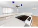 Modern kitchen with white countertops, stainless steel appliances, and stylish pendants for elegant dining at 7777 117Th St, Seminole, FL 33772