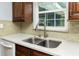 Close-up of a kitchen sink with granite countertops and modern faucet at 7777 117Th St, Seminole, FL 33772